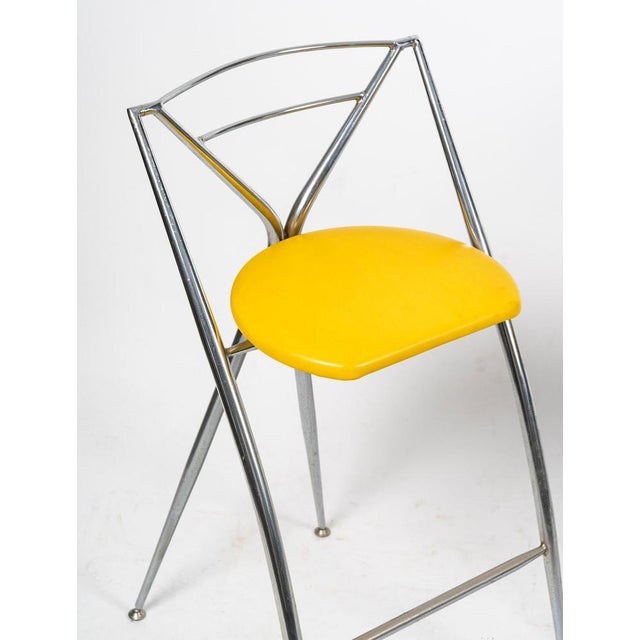 Pair of 1980s design stools in chromed metal and skai. Pair of 1980s design stools in chromed metal and skai. H: 84cm, W:...