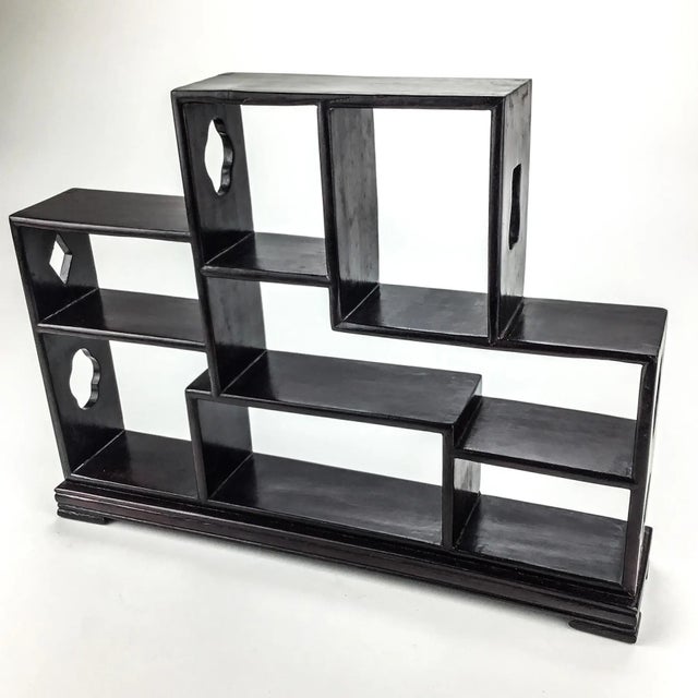 Detailed design in a traditional Ming style Chinese trinket shelf. Small compartments are perfect for your small delicate...