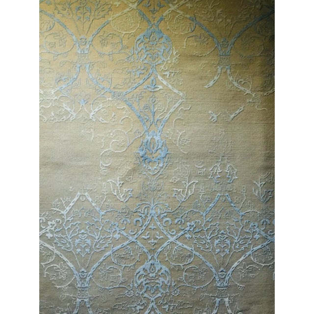 Hand knotted with silk fringes.