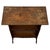 A charming early 20th-century English side table and bookcase in the Arts and Crafts tradition, finely crafted from oak...