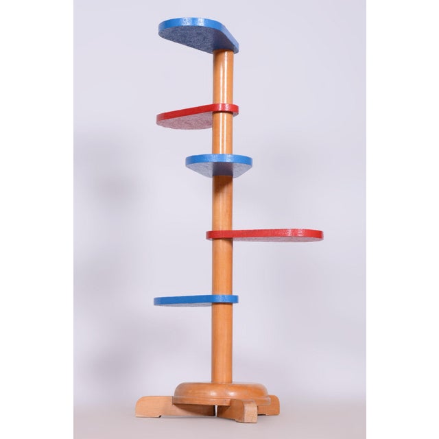 This Mid-Century flower stand from the mid-20th century was made in Czechoslovakia. Crafted from beech wood, it has...