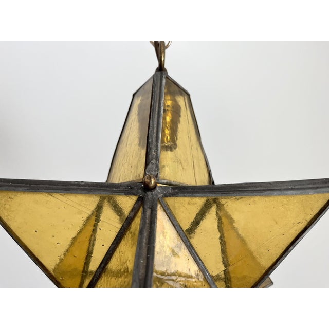Gorgeous petite mid century honey gold seeded and striated glass pendant light in the shape of a star with zinc panels and...