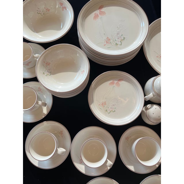 This beautiful Noritake Spring Orchid pattern gets lots of attention in a china cabinet. The 57-piece set consists of 10...