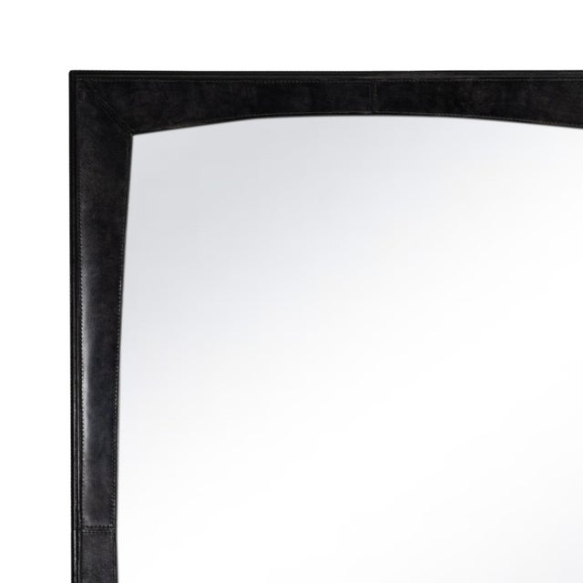 Striking and bold, the Estaban Leather Mirror’s rounded edges sit within a rectangular leather-wrapped frame. Its...