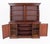 A fine Victorian mahogany bookcase of inverted form, standing on a plinth base The lower section features open shelving,...