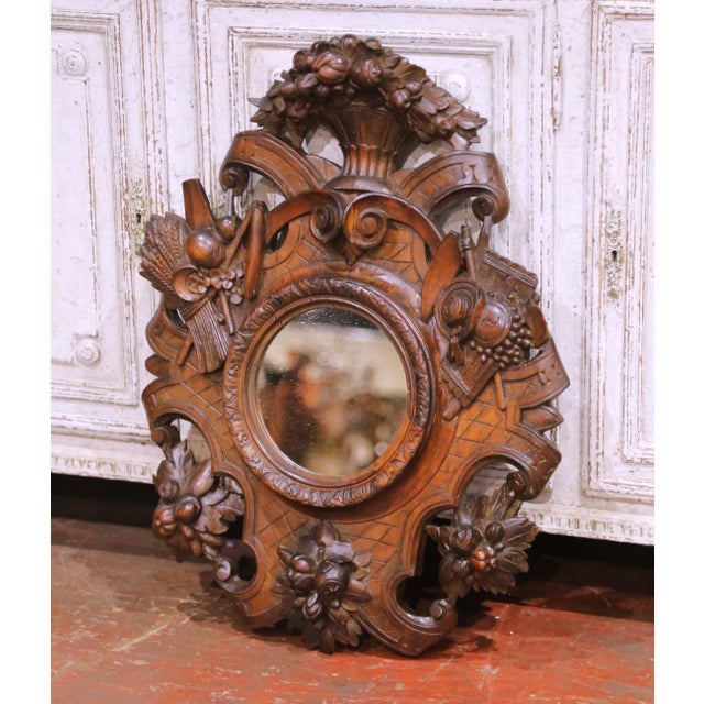 Decorate a study, hunting lodge, or rustic interior with this richly carved antique French oak mirror, crafted circa 1860...