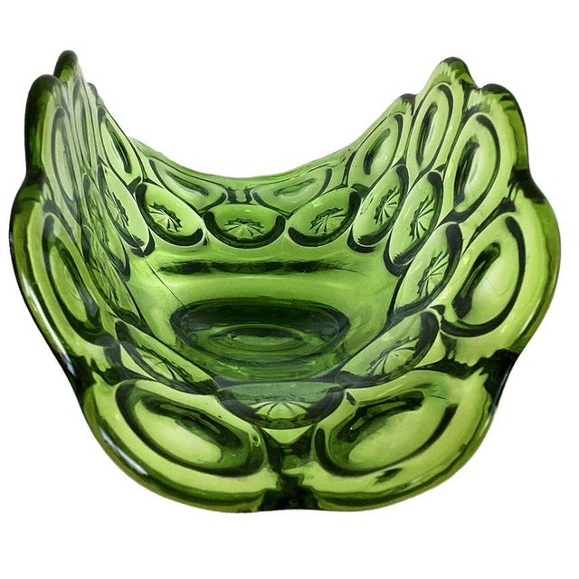 Vintage L E Smith banana boat dish features the Moon & Stars pattern in green glass. Its footed design makes it both...