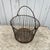 This vintage wire egg basket features a perforated bottom with a charming rusted patina, offering both utility and rustic...