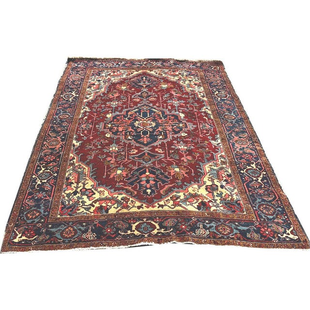 Antique Persian Heriz rugs are highly regarded hand-knotted carpets originating from the Heriz region in NW part of Iran...