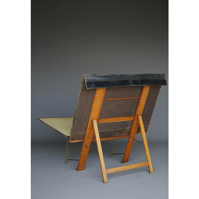 19th-century, Victorian-era portable, self-supporting wooden print stand holding a card and partly leather portfolio....