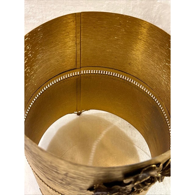 This vintage STYLE BUILT Hollywood Regency style boudoir gold floral trash can is a luxurious and charming addition to any...