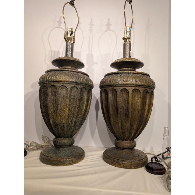 Pair of substantial lamps from the 1960's, multi colored in greens, browns, and amber's. These lamps are 29 inches high...