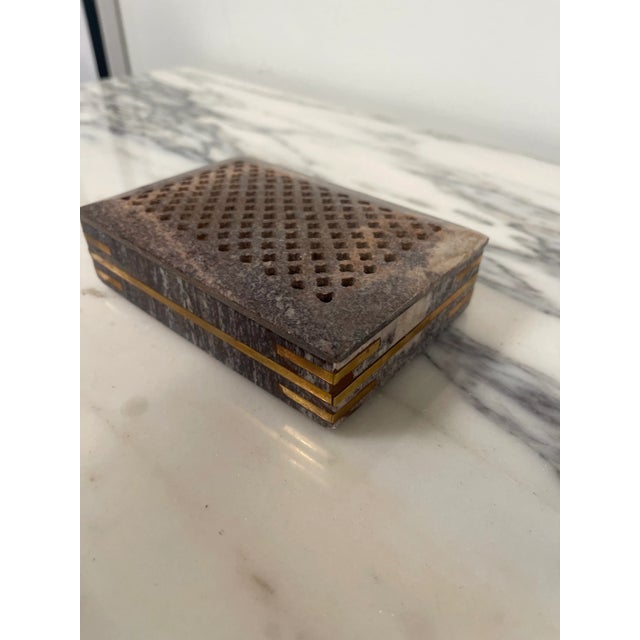 What sets this stone box apart is the artful brass inlay that adorns its surfaces. The brass detailing, crafted with...