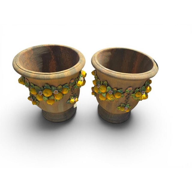 Elegant pair of Italian garden urns crafted in glazed terracotta during the 1950s. Combining traditional Mediterranean...