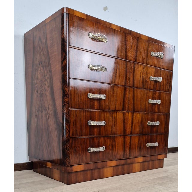 Functional, practical, and at the same time elegant, this Venetian Art Deco dresser is entirely made of walnut burl wood,...