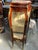Showcase your treasured decorative objects in this charming French-inspired display vitrine. Featuring a rich reddish-...