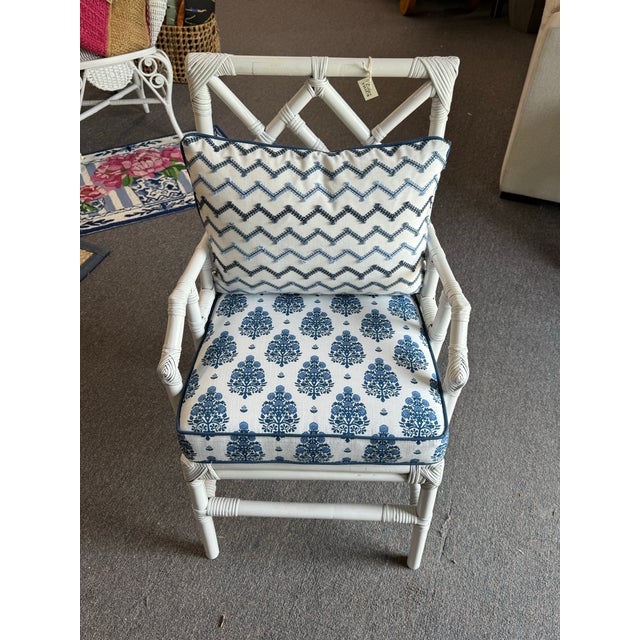 This simple, chic bamboo chair has been painted white and outfitted with a gorgeous cushion and lumbar pillow. The cushion...