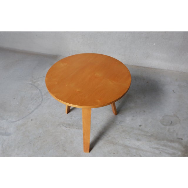 A small round sidetable from the series that was first presented at the Salon des Arts Decoratifs in Paris, 1949. Edited...