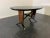 Elegant 1950s oval table Cross under top, feet and profiles are ebonised. Under top is the finely inlaid base with...