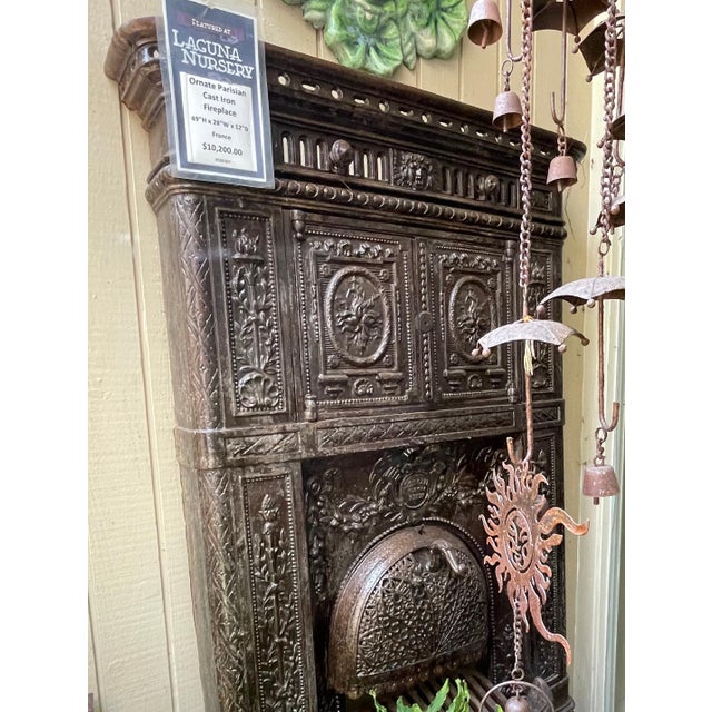 Ornate Iron work, Parisian Cast Iron Fireplace. Antique French design early 1900s cast iron parlour stove richly decorated...