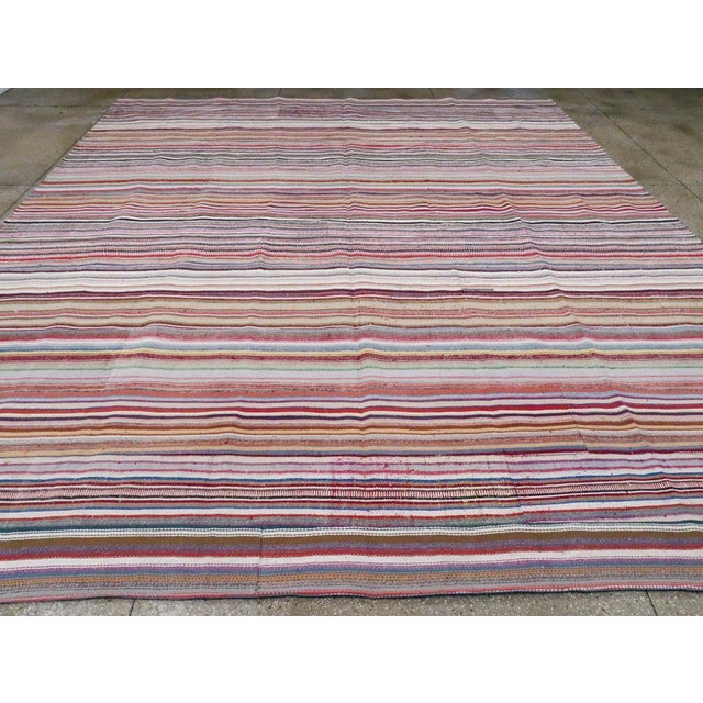 A vintage Turkish Flatweave large room size carpet handmade during the 21st century. Measures: 13' 1" x 15' 1"