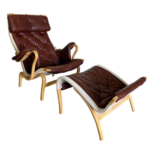 1980s Brown Leather Pernilla Chair and Ottoman by Bruno Mathsson for Dux Sweden, 2 Pieces For Sale