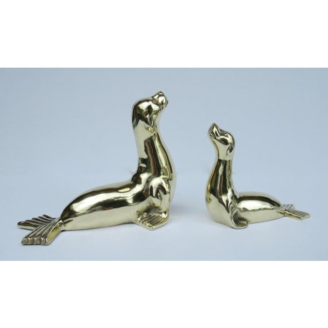 Vintage: C.1960-70's,, Are these whimsical polished brass seals, a larger one and a smaller one, hence "mama and her cub."...