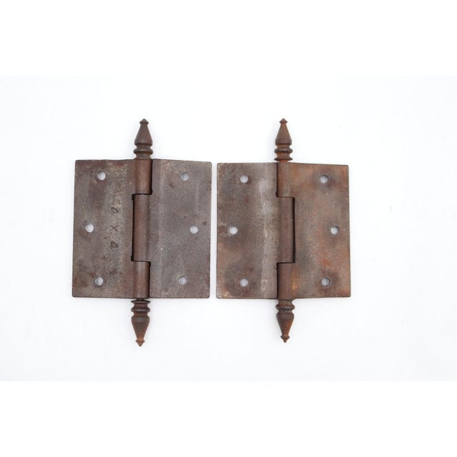 Victorian style door hinges made of cast iron with steeple tips, three knuckles, and a template hole pattern. The original...