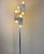 Very well-preserved original floor lamp by Geatano Sciolari. Beautiful thick glass shade mounted on brushed aluminum....