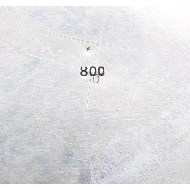 Silver platter with baroque decor in the margins. Brands: manufacturer, "800" silver test. Diameter 33cm. Total weight:...