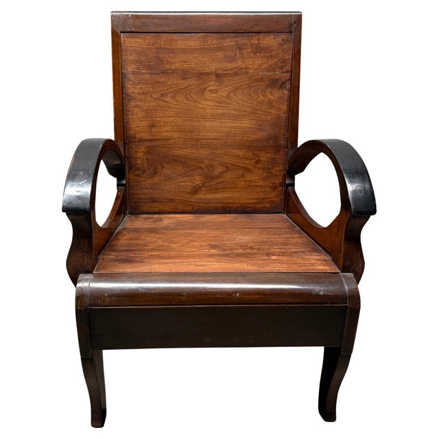 Beautiful carved arms on this antique Dutch Colonial chair from Indonesia. Circa 1950. Pair available. The price and...