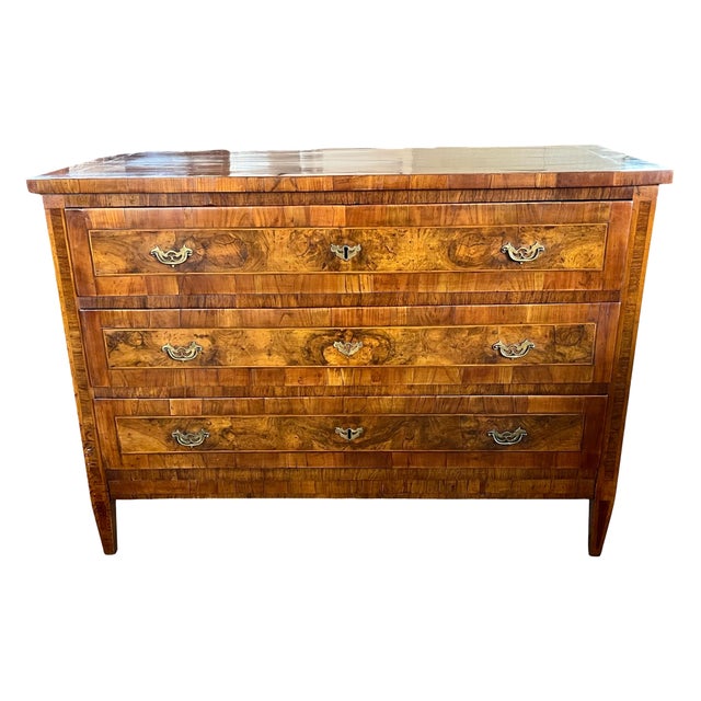 Neoclassical commode hand-made in Italy in the late 1700s using walnut and decorated with walnut veneer. This is an...