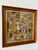 A charming antique hand-worked needlepoint depicting a three-figure pastoral scene surrounded by an exceptionally...
