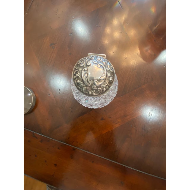 Beautiful bottle with stopper with Sterling silver cover. My guess is this is 1880’s to 1890’s. I’ve posted a photograph...