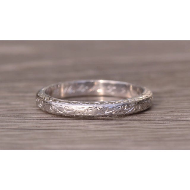 The Lock Haven: Antique Platinum Hand Engraved Wedding Band. The hand engraving on this antique platinum wedding band...