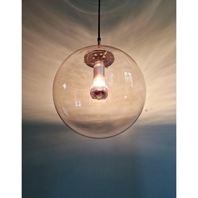 Large space age pendant light in smoked glass and chrome-plated metal, produced by the german manufacturer glashütte...