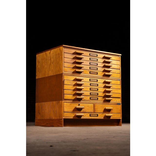 Pair of mid-20th-century oak architectural flat-file cabinets by Mayline Company, Inc. of Sheboygan, Wisconsin. Each...