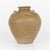 This wonderfully large Chinese ceramic vase or storage jar dates from the Ming dynasty(1368-1644) With a beige glaze and...