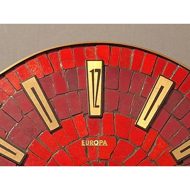 Wall clock by Europa, 1960s, mosaic and brass. Battery-operated quartz movement. This piece has an attribution mark, I am...