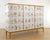 Vintage cabinet crafted in Sweden ca 1935 in honey colored birch. Later covered with illustrations Nordens Flora by C.A:M...