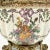 A beautifully intricate porcelain jar with a cover. This piece comes in 3 pieces: a brass base, jar with brass edge, and...