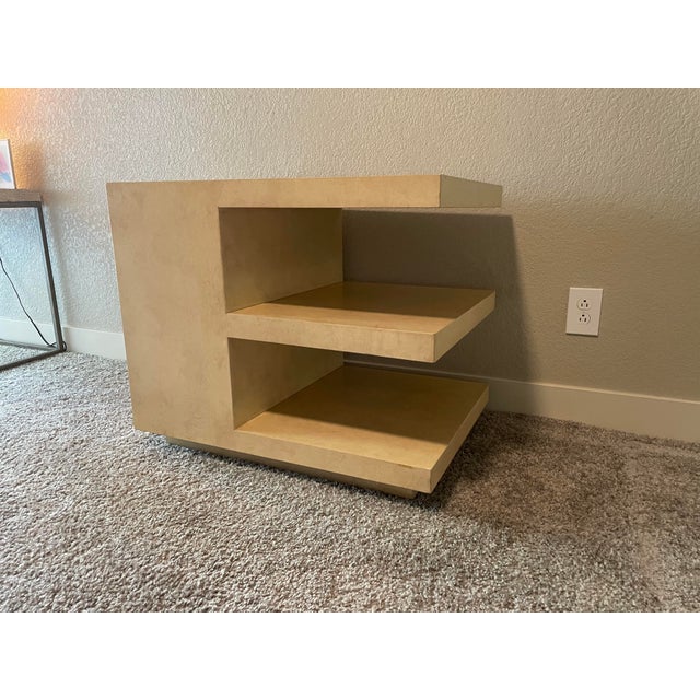 The “E” End Table by Kreiss provides three layers of space to accessorize or for storage, while its geometric wood design...