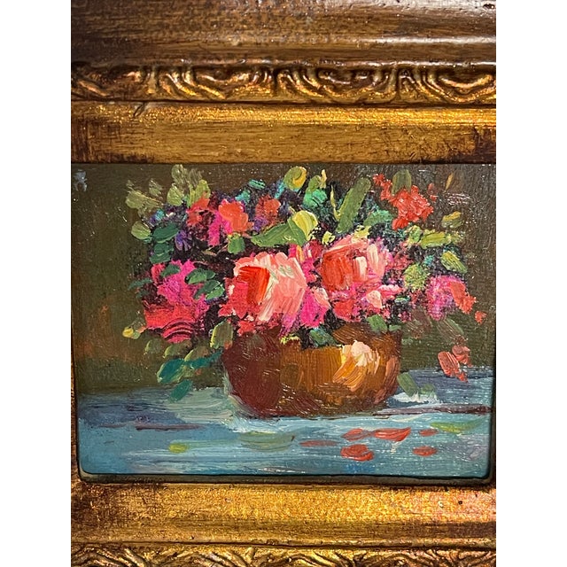 Oil on Board lovely floral painting framed in antiqued frame.