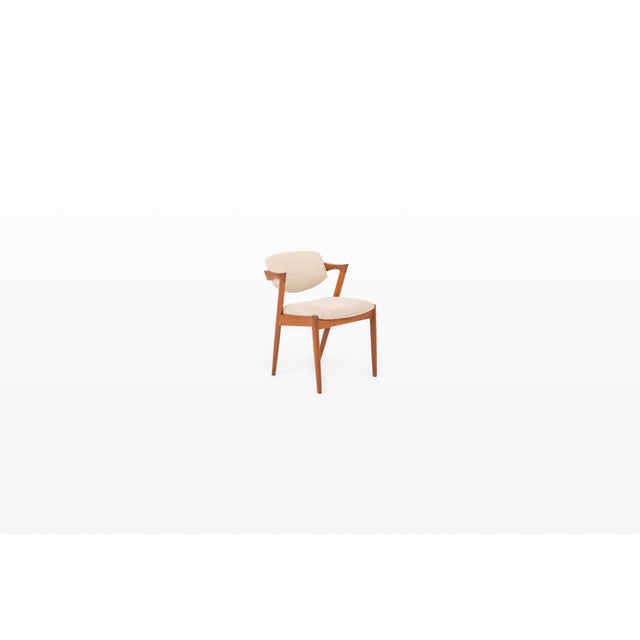 Designed from Schou Andersen Møbelfabrik, this elegant armchair is a refined example of Danish Modern design from the...
