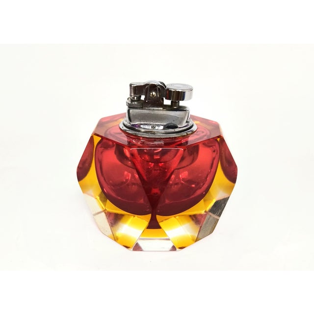 Spectacular vintage lighter made of faceted Murano glass in yellow and red, with clear glass accents. Designed by Flavio...