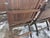 Discover a remarkable piece of American history with this complete, matching set of 12 antique folding theater chairs....