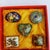This is a charming set of five vintage cloisonné enamel miniature boxes, presented together in a red, fabric-lined...