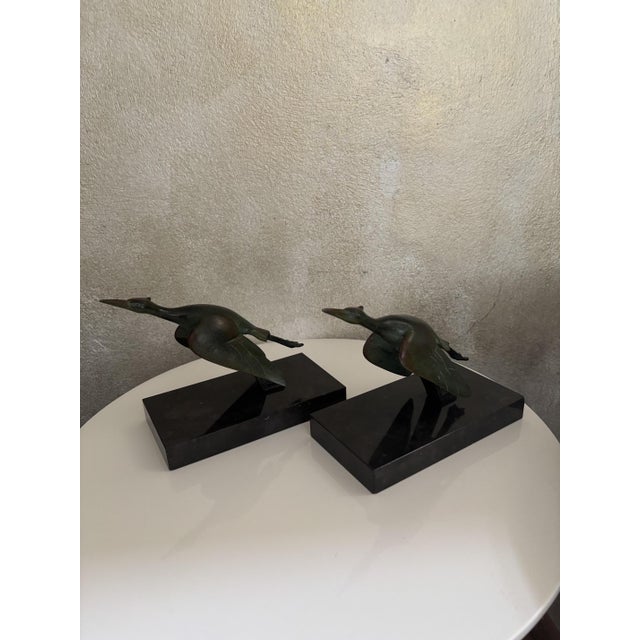 Pair of French Art Deco bookends, dating from circa the 1930s. The underside of one base retains its original, historic...