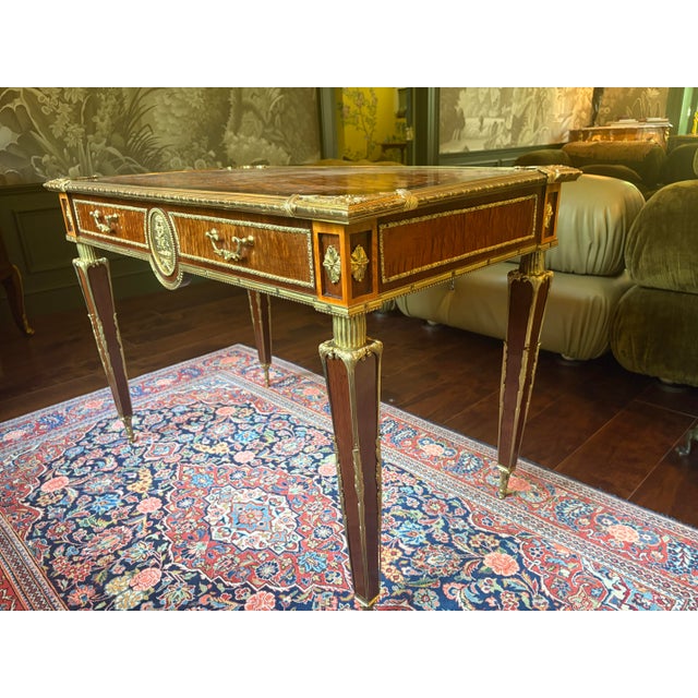 This is a gorgeous desk made by cabinet maker Donald Ross in England in the 19th century, in the style of French furniture...