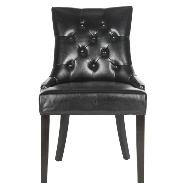 The stylish ring chair by transforms any dining room with instant glamour. Dressed up with silver nailheads and a clever...